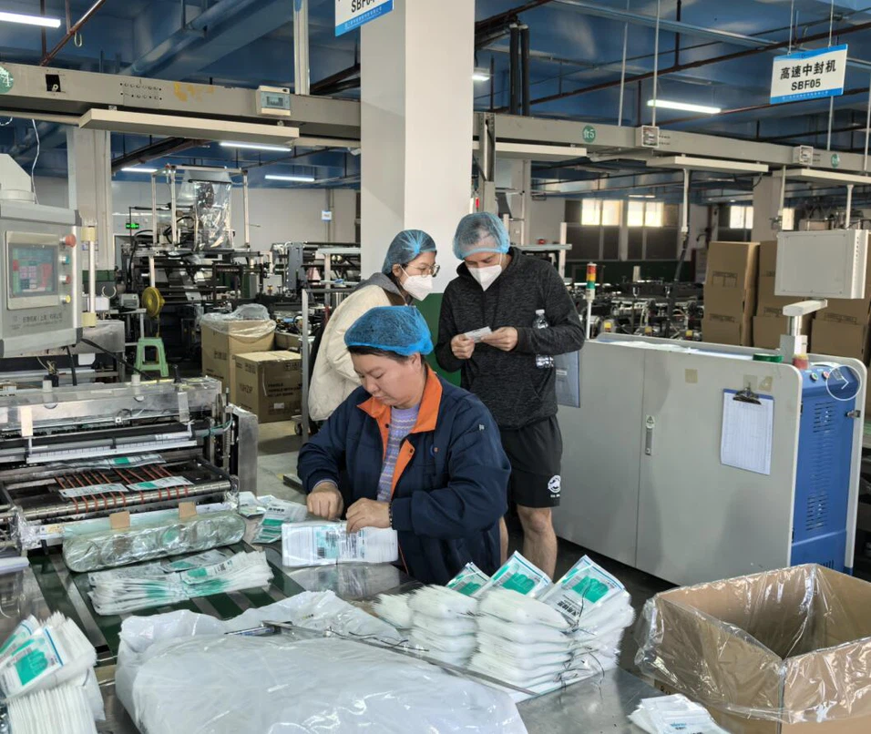 Workers produce plastic packaging bags Workers produce plastic packaging bags